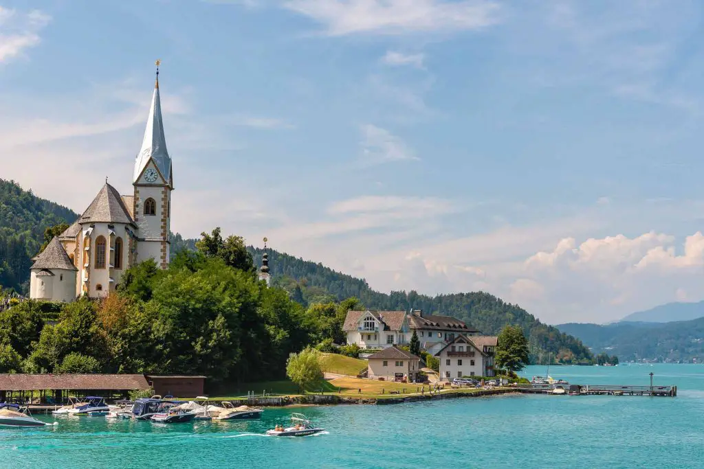 WORTHERSEE, AUSTRIA View of the Worthersee lake with Maria Worth church, Carinthia, Austria